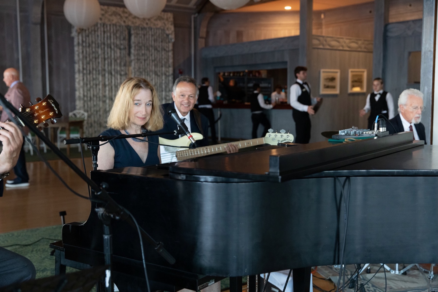 Debbie Sullivan singing and playing piano at an elegant private event